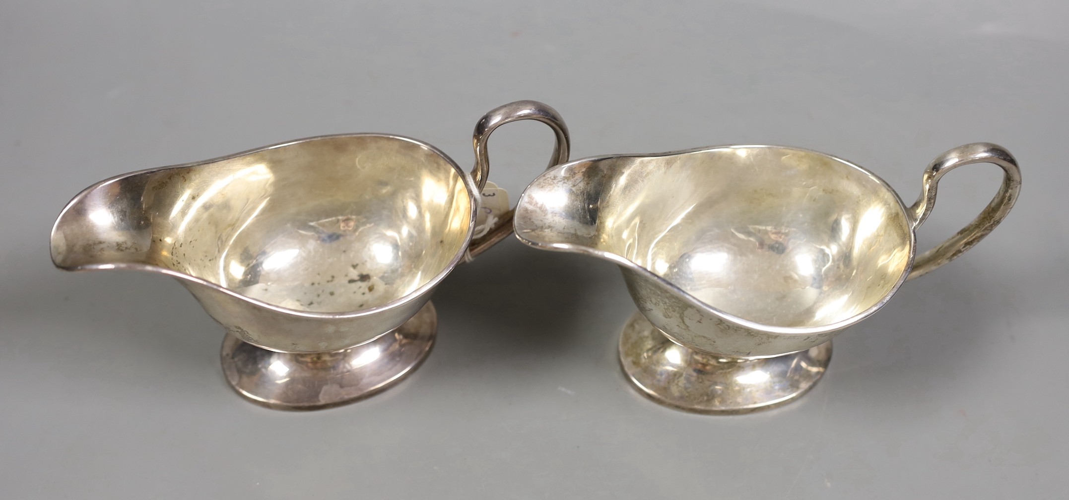 A pair of George V silver pedestal sauceboats, William Hutton & Sons, Sheffield, 1916, 11.4oz.